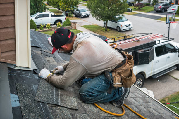 Professional Roofing technician working in Mc Bain, MI